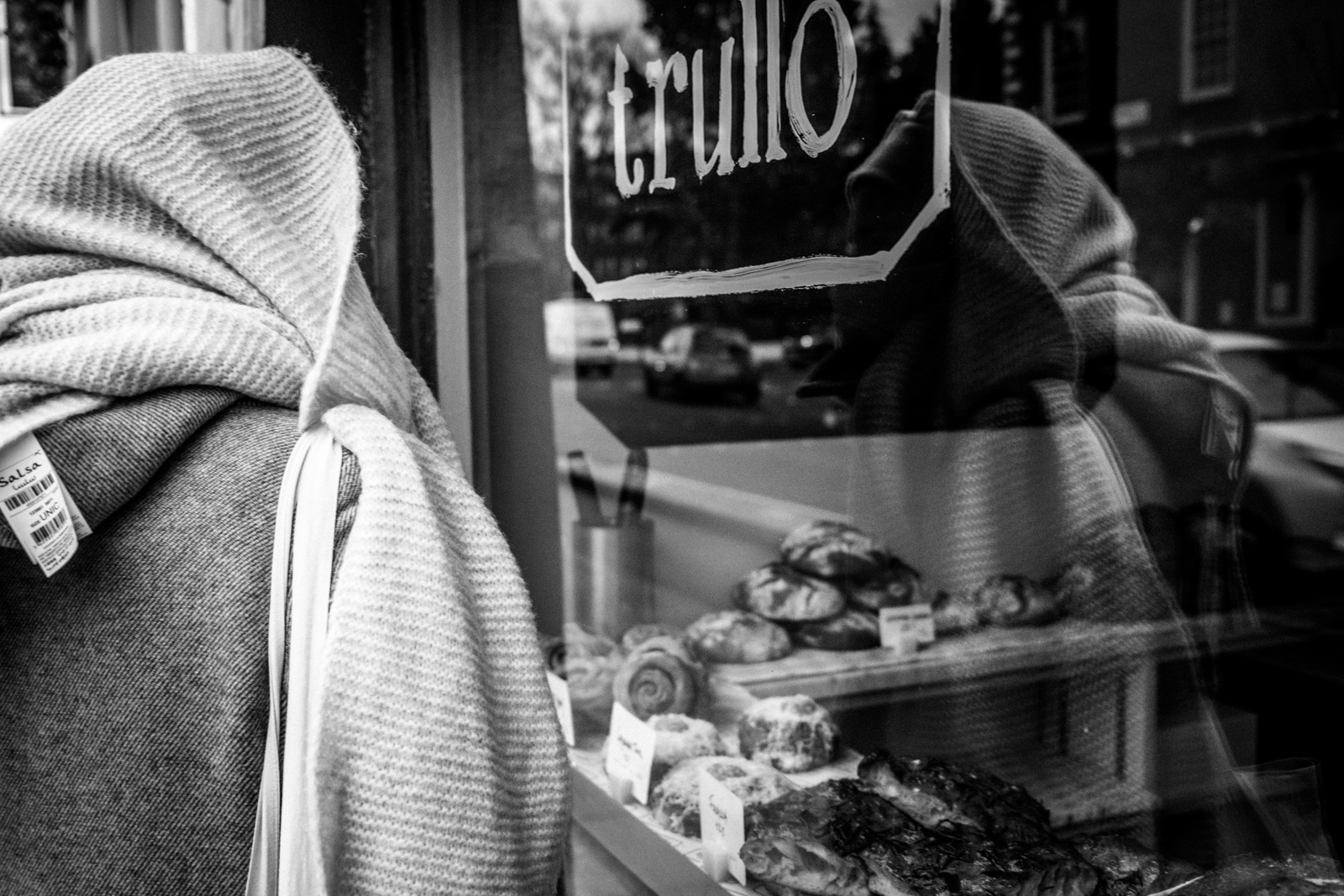 Person looking through bakery window